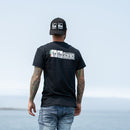 LoCo Science Short Sleeve T-Shirt on model as he stares into the distance